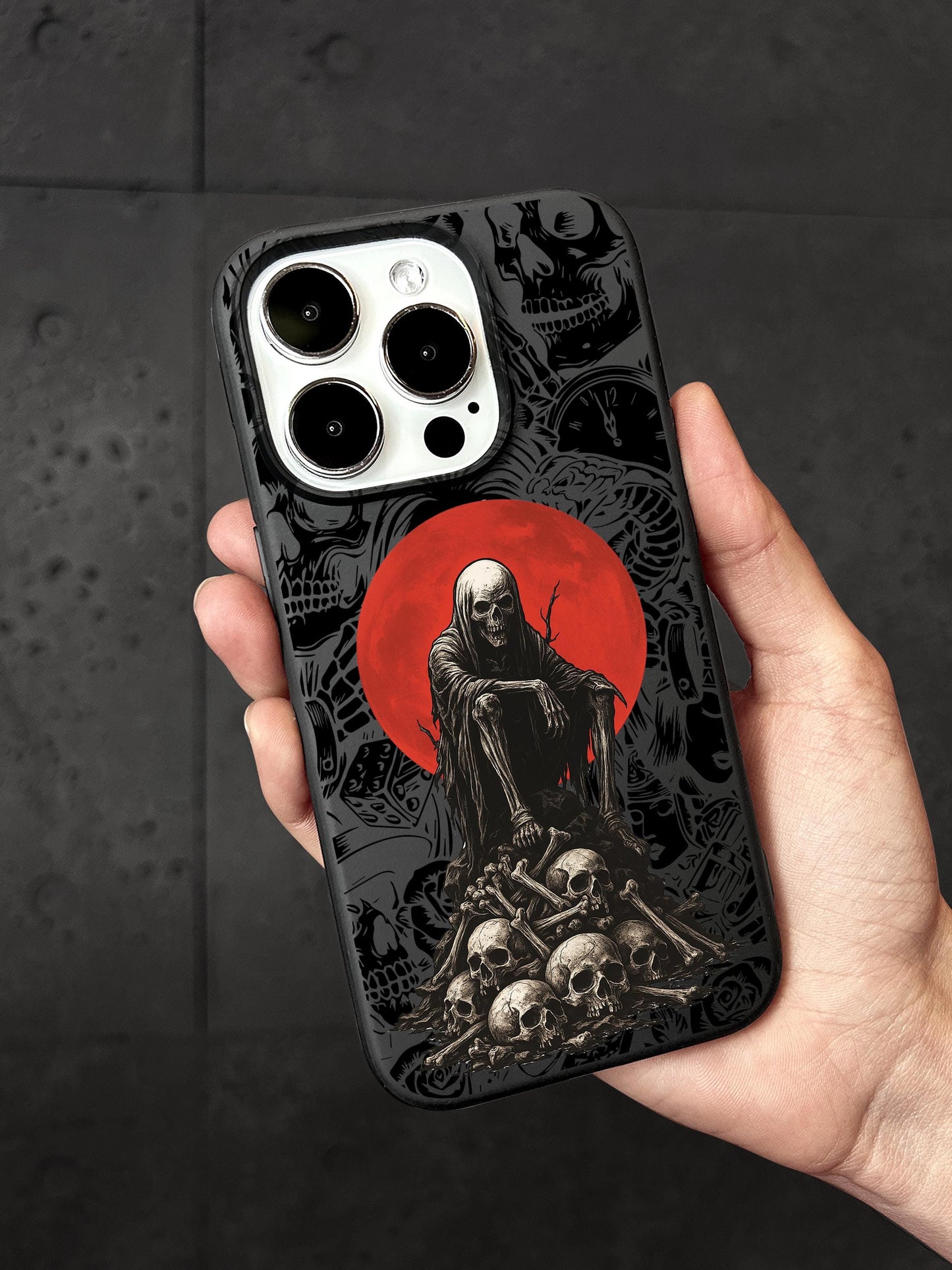 a person holding a phone case with a picture of a skeleton on it