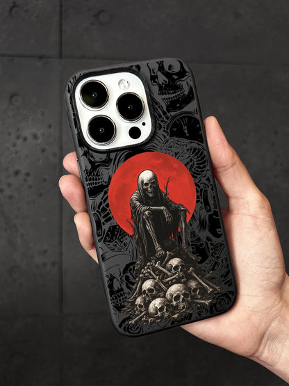 a person holding a phone case with a picture of a skeleton on it
