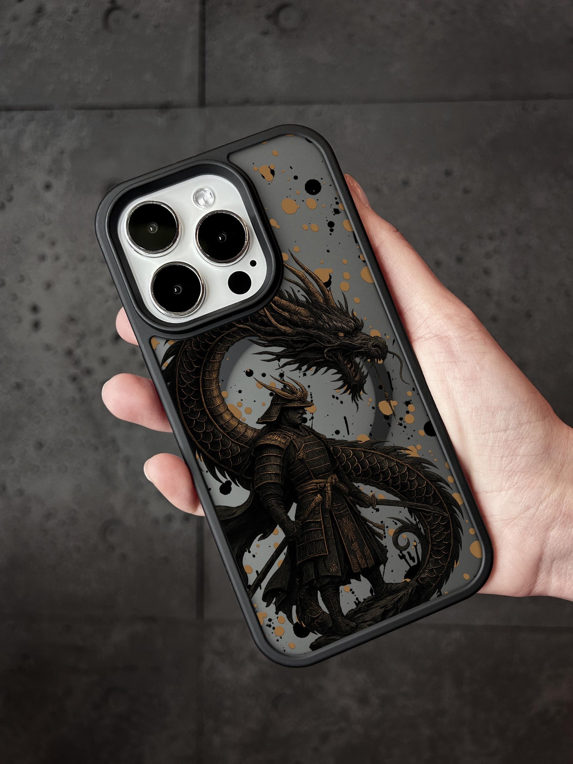 a person holding a phone case with a dragon on it