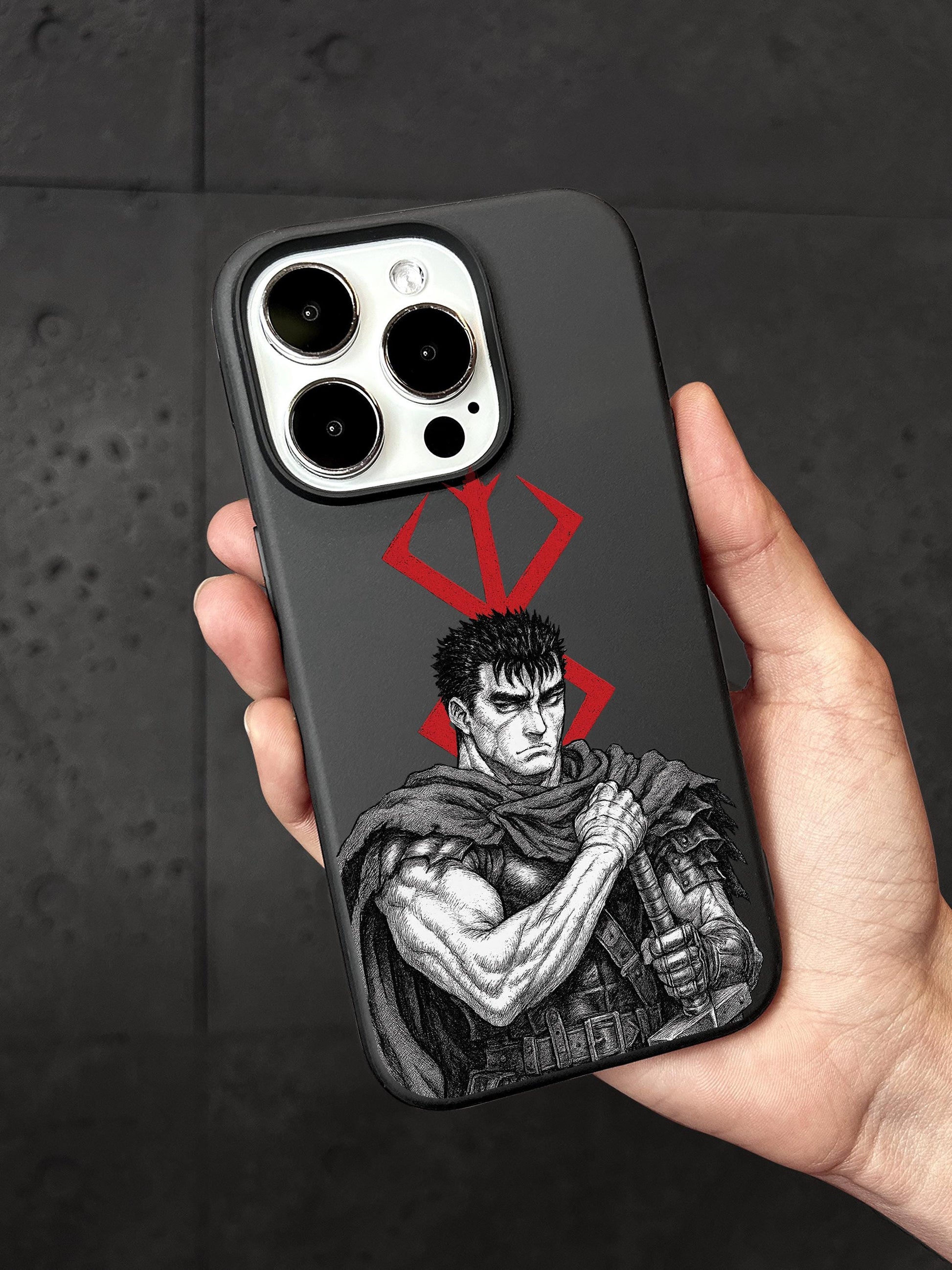 a hand holding a phone case with a picture of a man