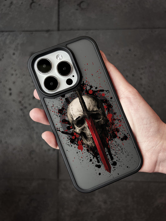 a person holding a phone case with a skull on it