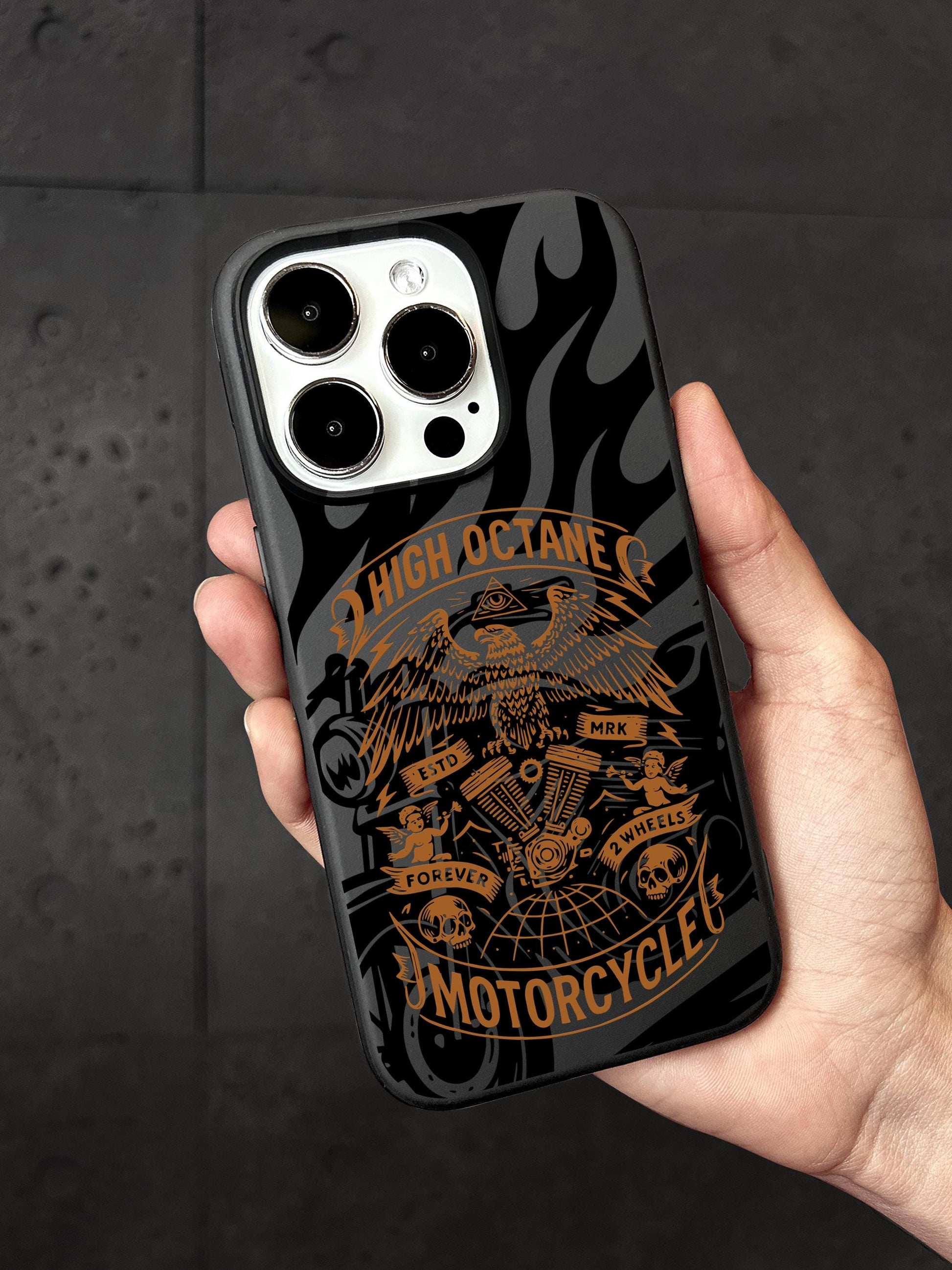 a person holding a phone case with an image of a motorcycle