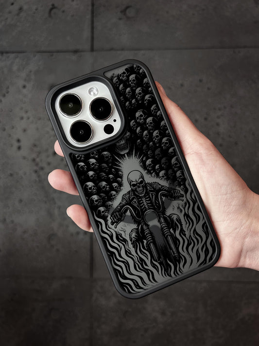 a person holding a phone case with a picture of a skeleton on it