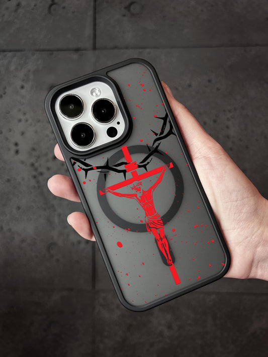 a person holding up a phone case with a picture of a cross on it