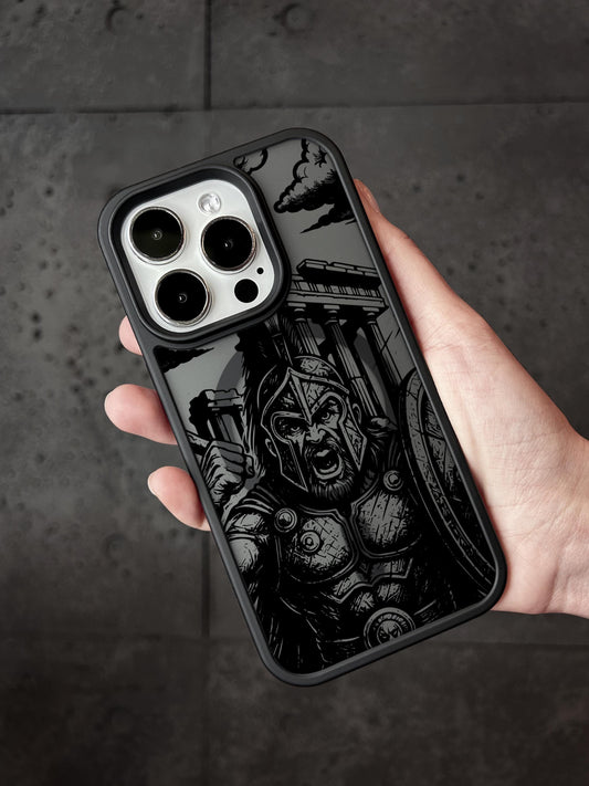 a person holding a black and white iphone case
