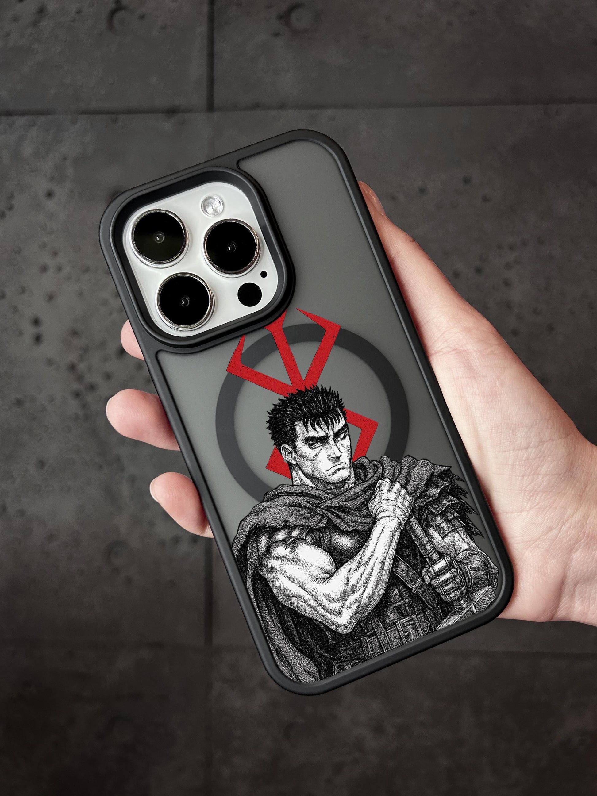 a person holding a phone case with a picture of a man on it