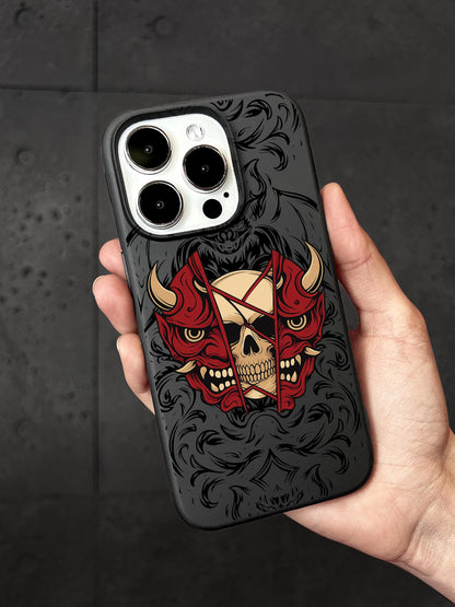 a hand holding a phone case with a skull and devil on it