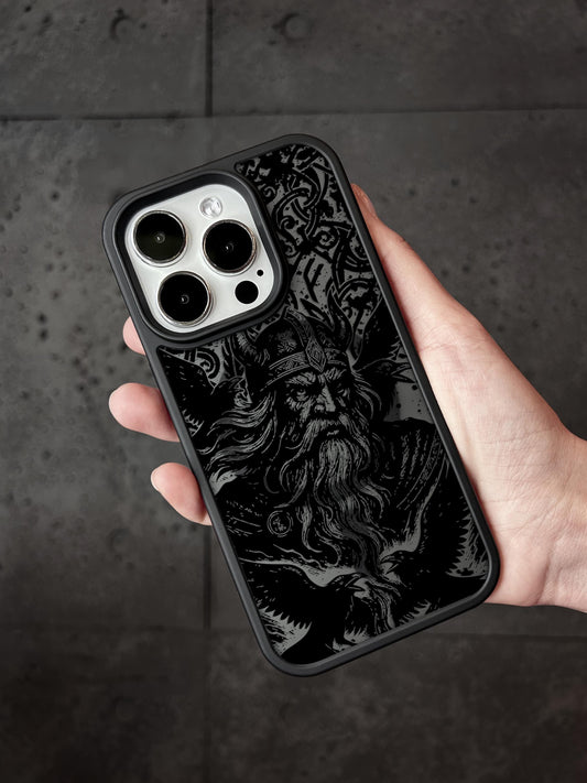 a hand holding a black and white iphone case
