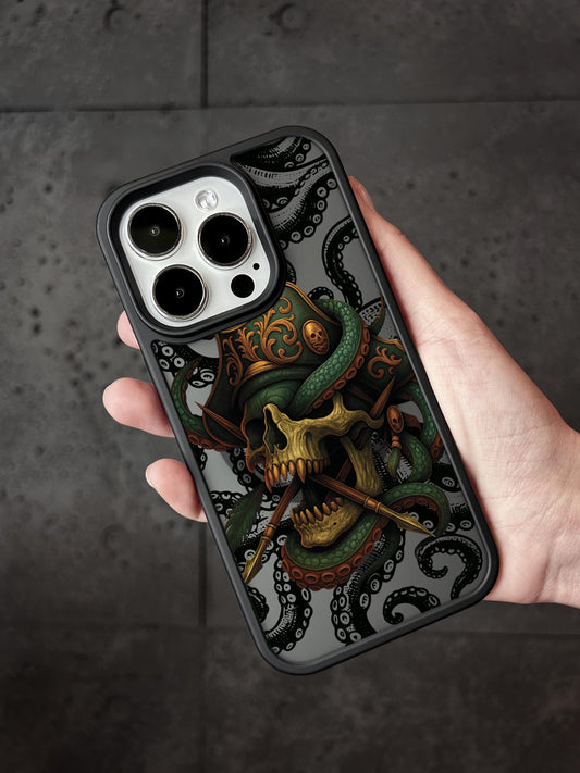 A hand holding a phone case with a skull and octopus design.