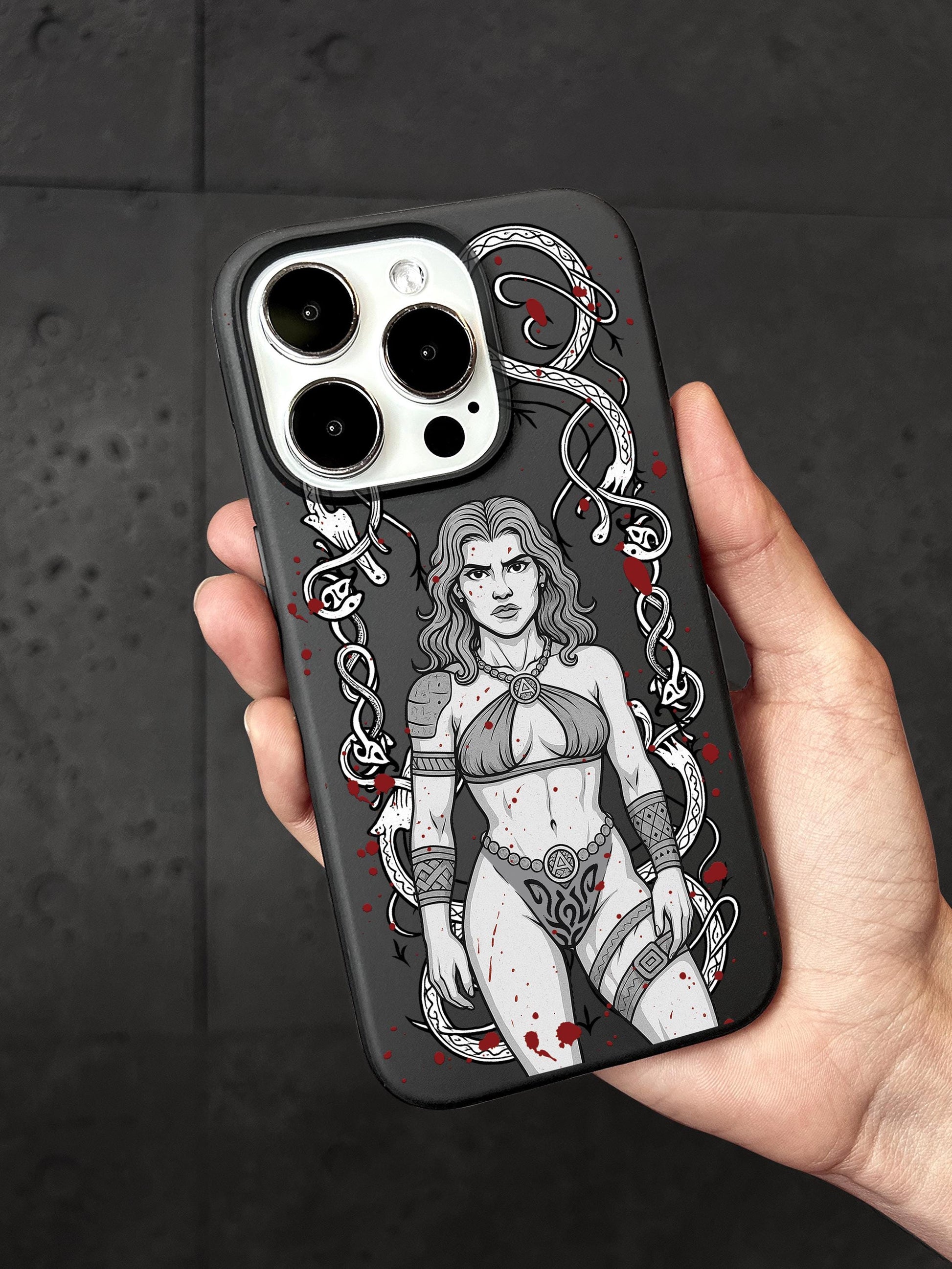 a person holding a phone case with a picture of a woman on it