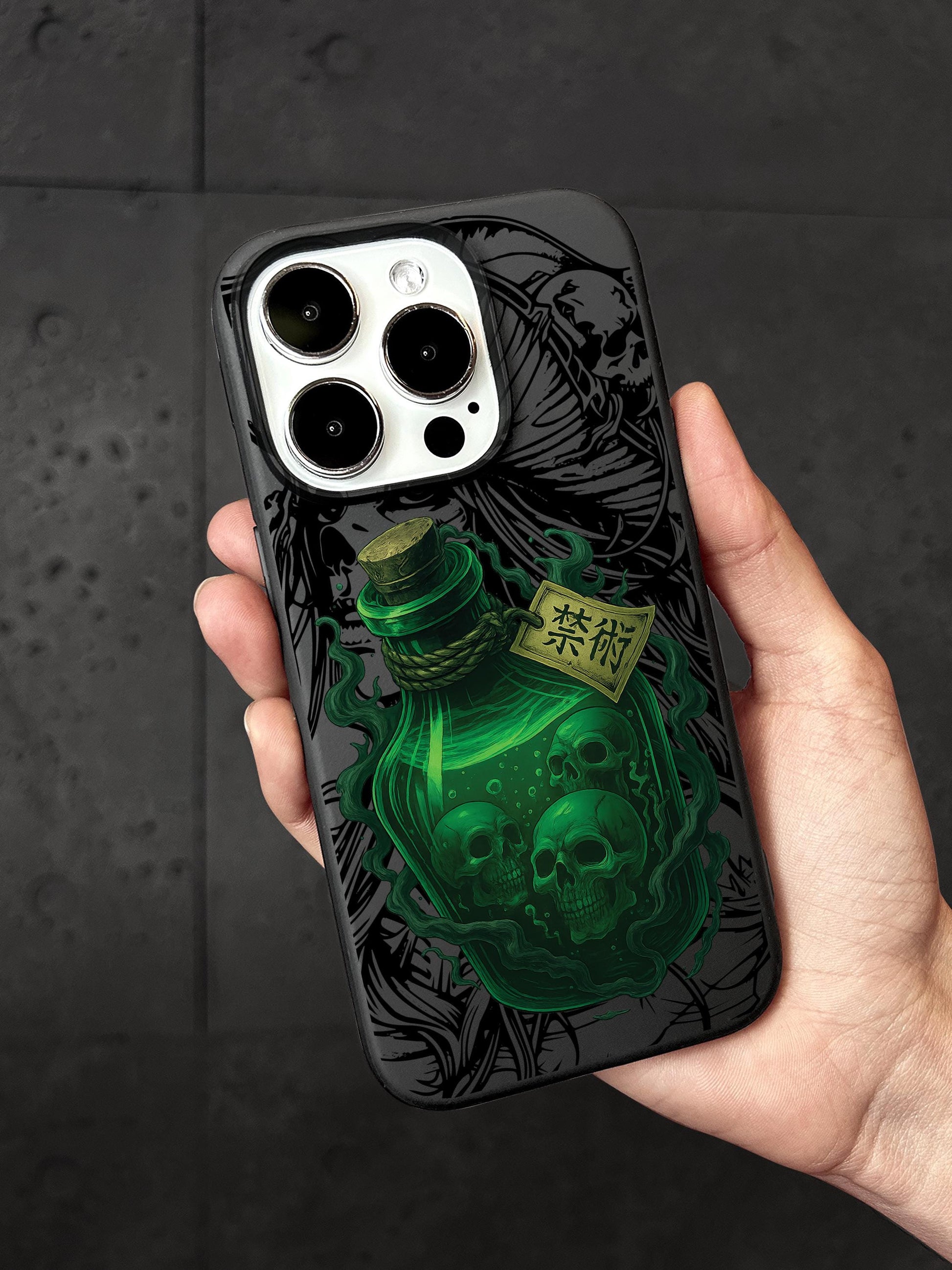 a person holding a phone case with a green bottle on it