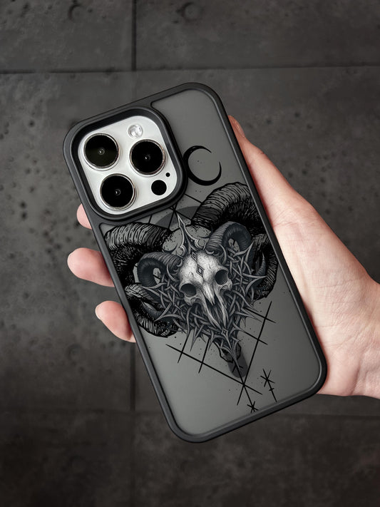 a person holding a black and white iphone case