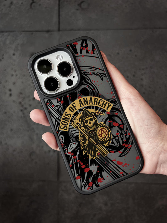 a person holding a black phone case with a skull on it