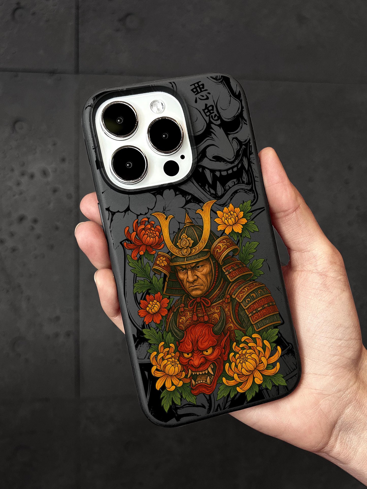 a hand holding a phone case with a picture of a samurai
