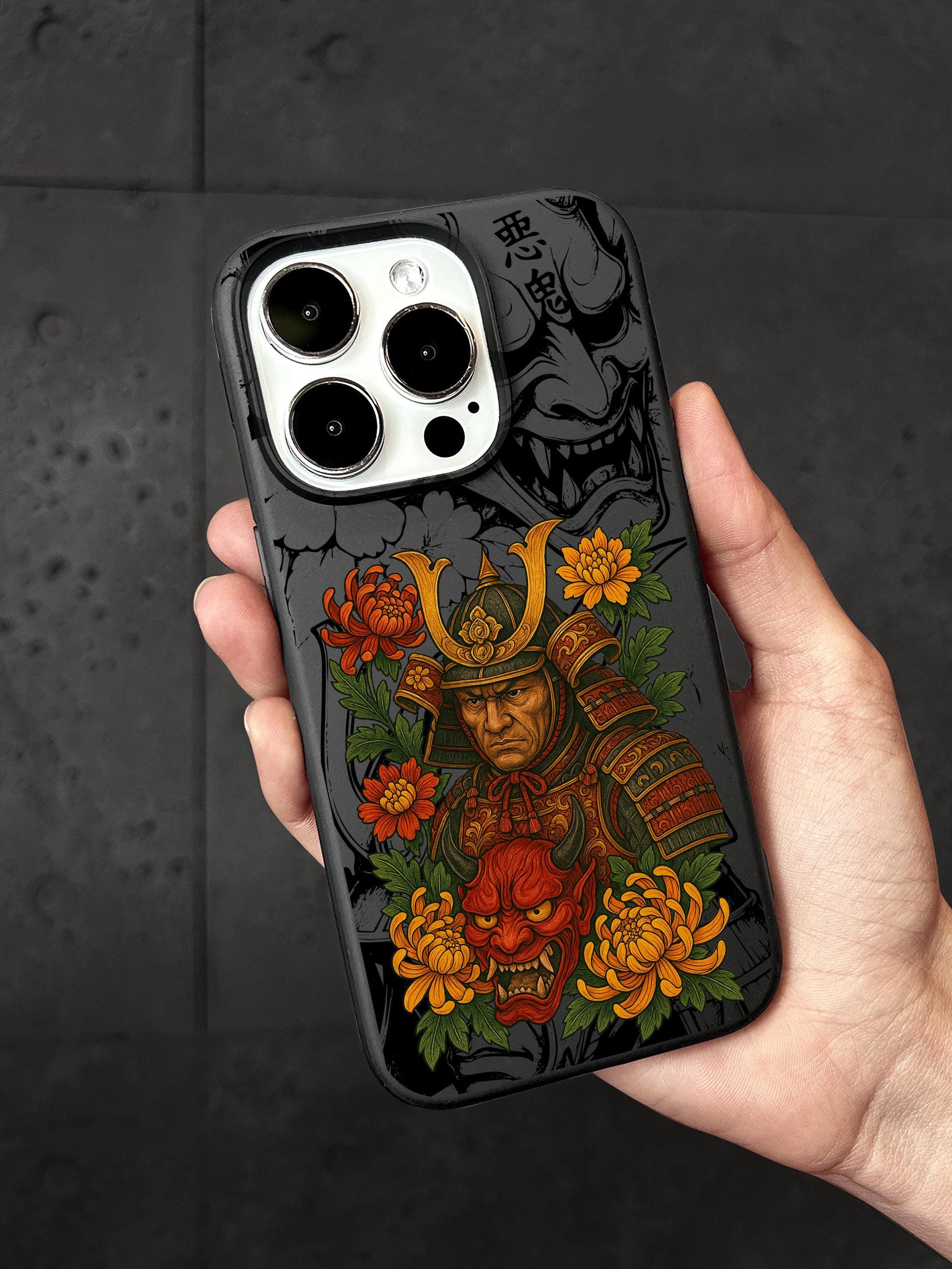 a hand holding a phone case with a picture of a samurai