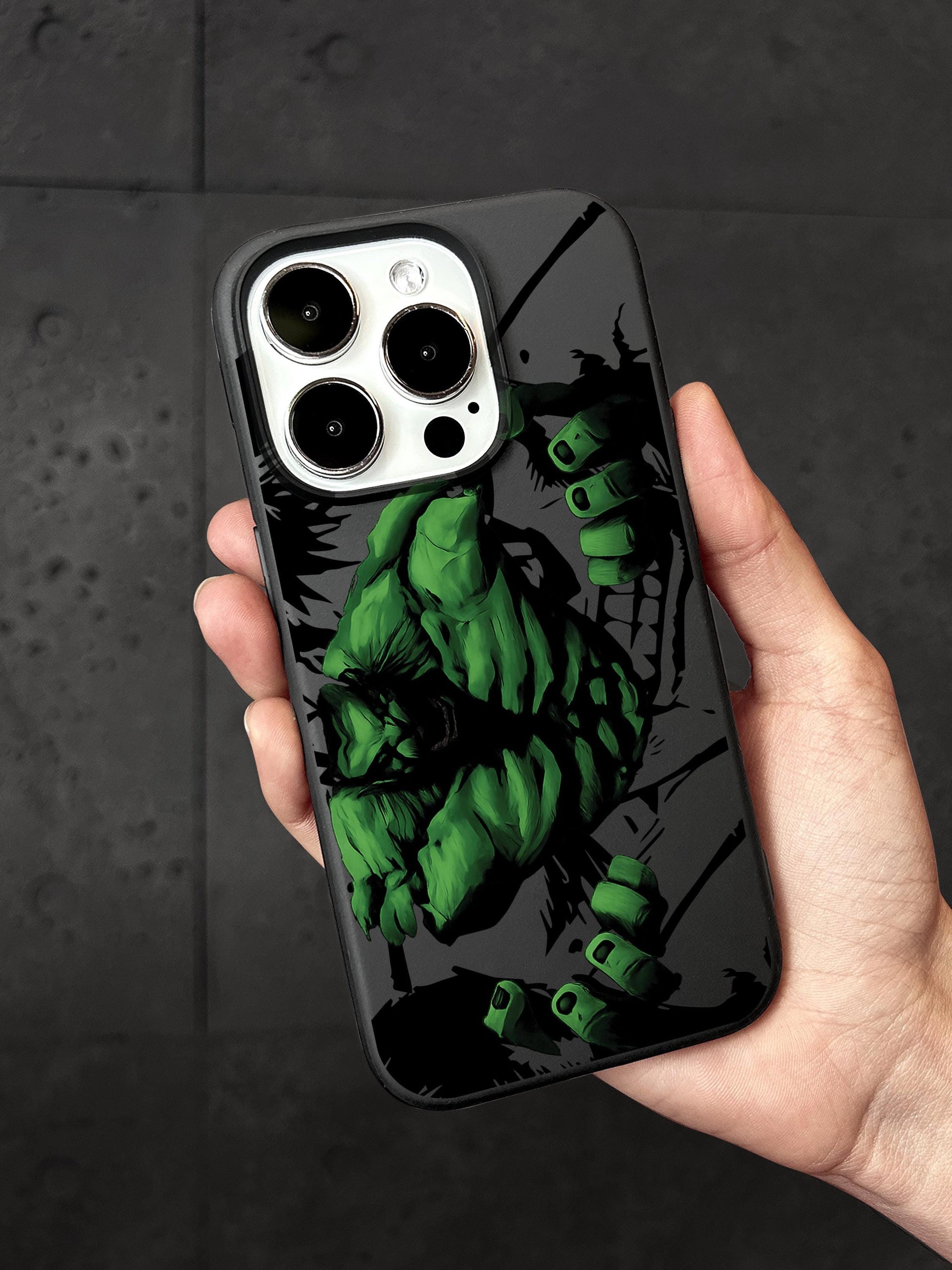 a hand holding a phone case with a picture of a hulk