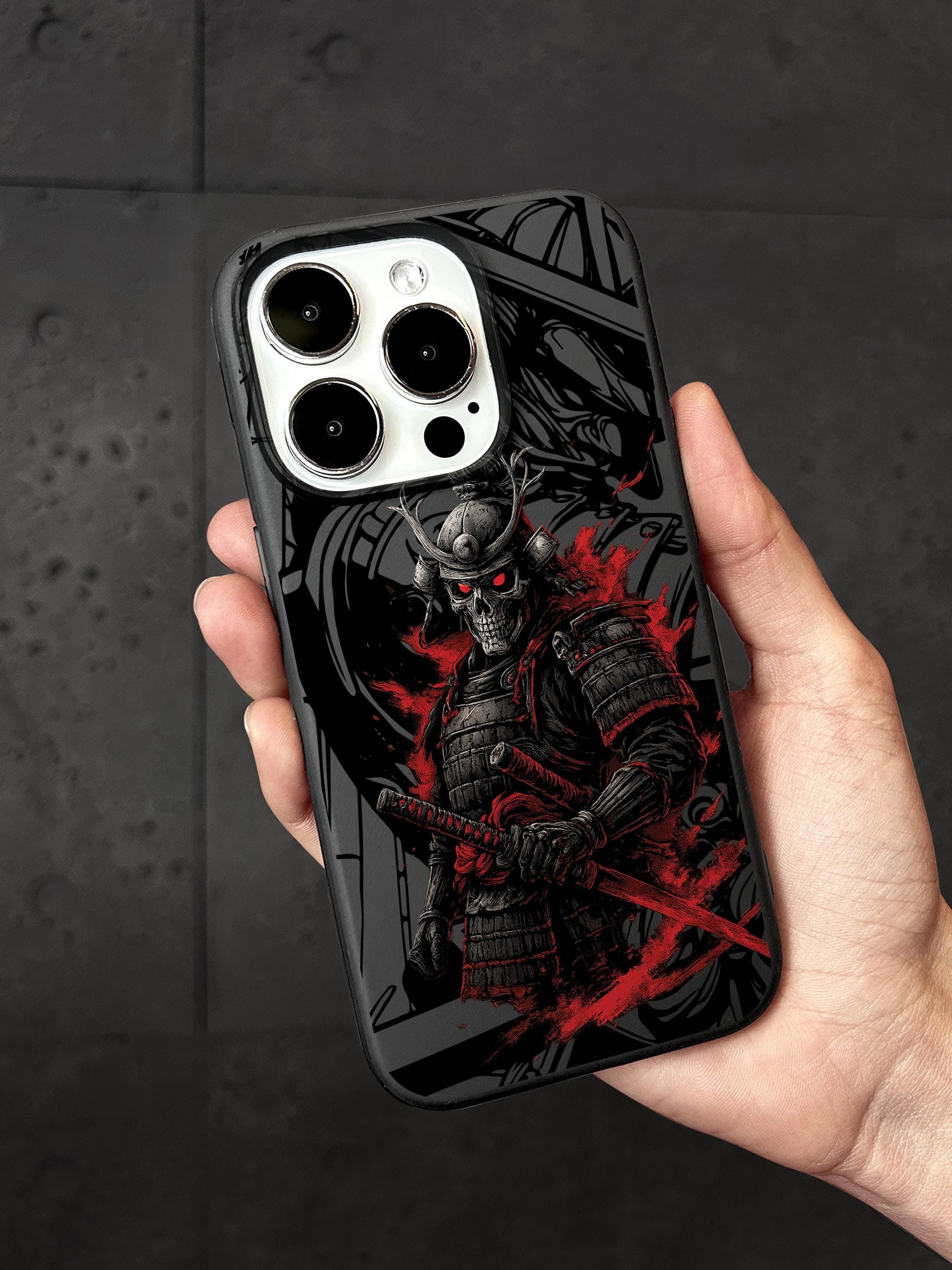a person holding a cell phone case with a picture of a skeleton on it