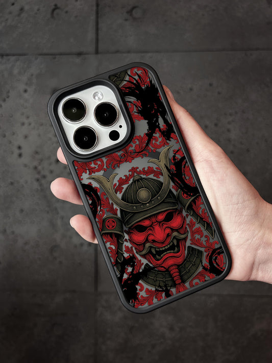 a hand holding a red and black phone case