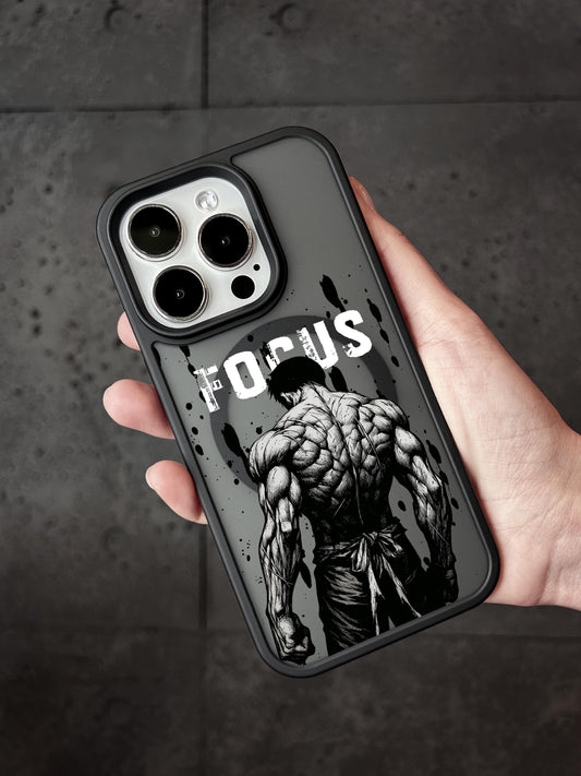 A person&#39;s hand holding a phone case with a muscular, tattooed figure and the word &quot;FOCUS&quot; printed on it.