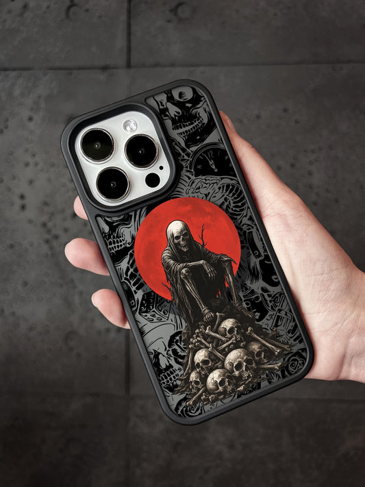 a person holding a phone case with a picture of a skeleton on it