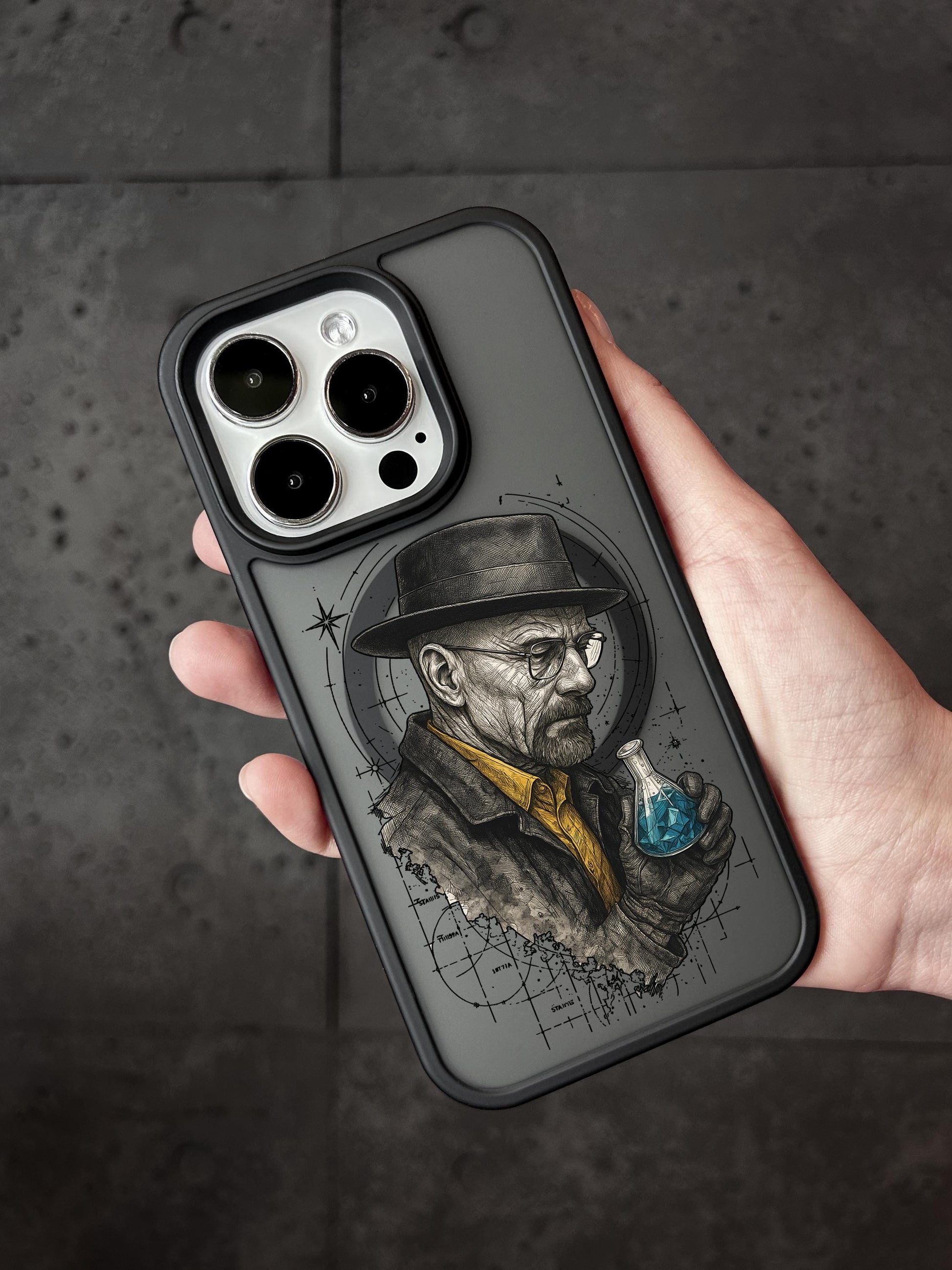 A person&#39;s hand holding a phone case featuring an illustration of a man wearing a hat and holding a blue object.