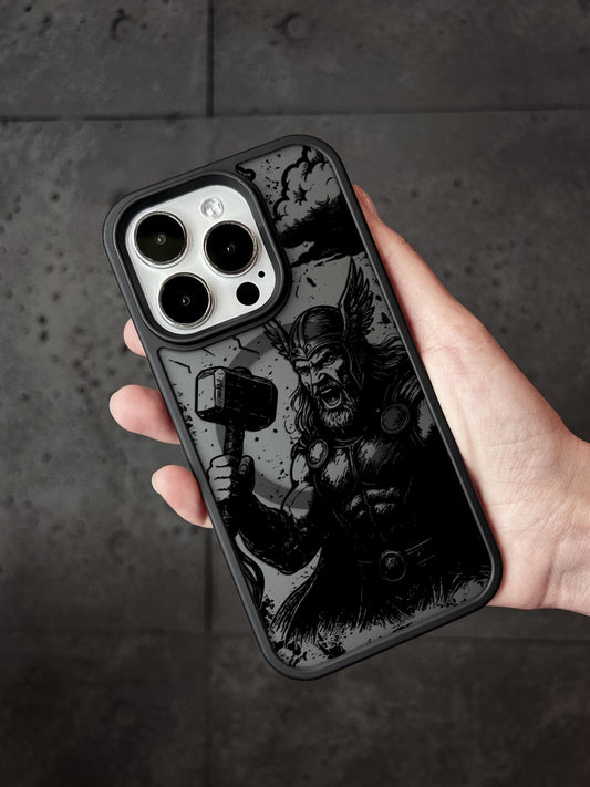 a hand holding a black and white iphone case