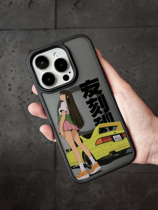 A person holding a phone case with an anime-style illustration of a girl and a yellow car.