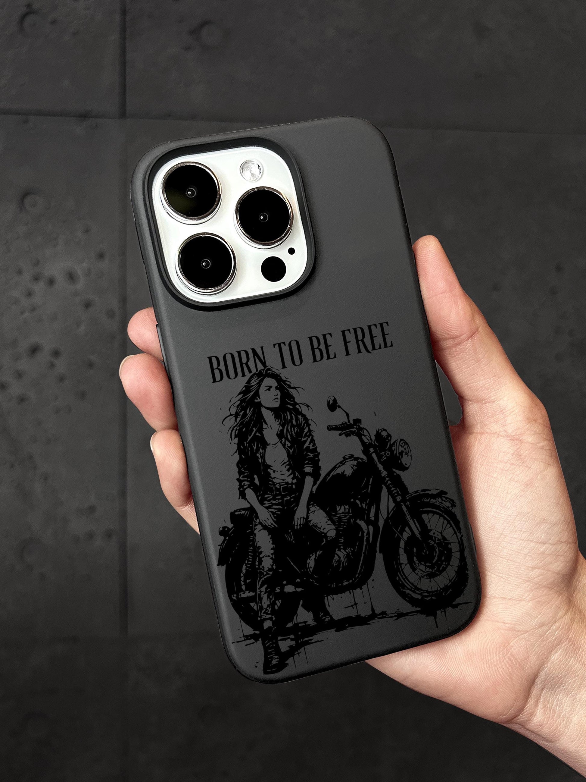 a person holding a black phone case with a picture of a woman on a motorcycle