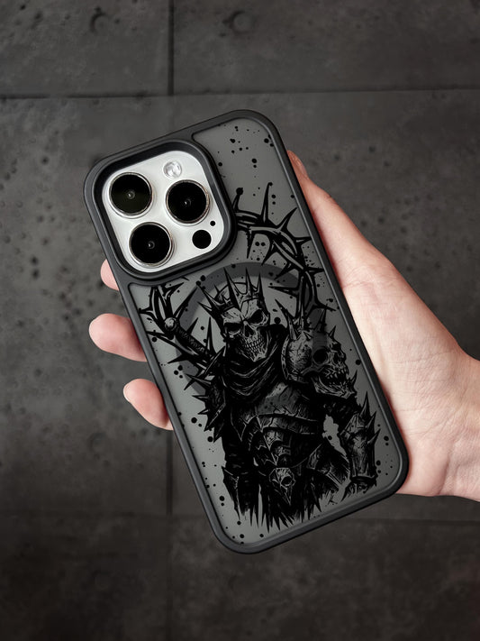 a hand holding a black and white iphone case