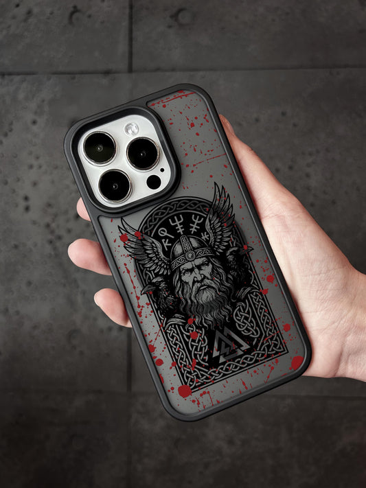 a hand holding a black and red phone case