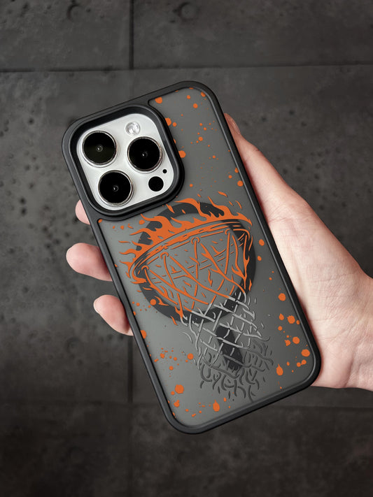 A hand holding a phone case with a basketball design on it.
