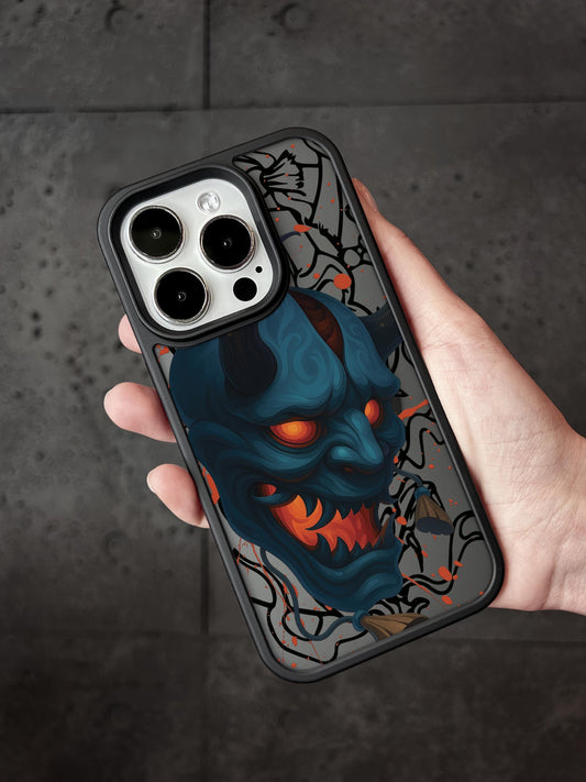 A hand holding a phone case with a graphic design featuring a blue devil-like creature with glowing red eyes and sharp teeth.