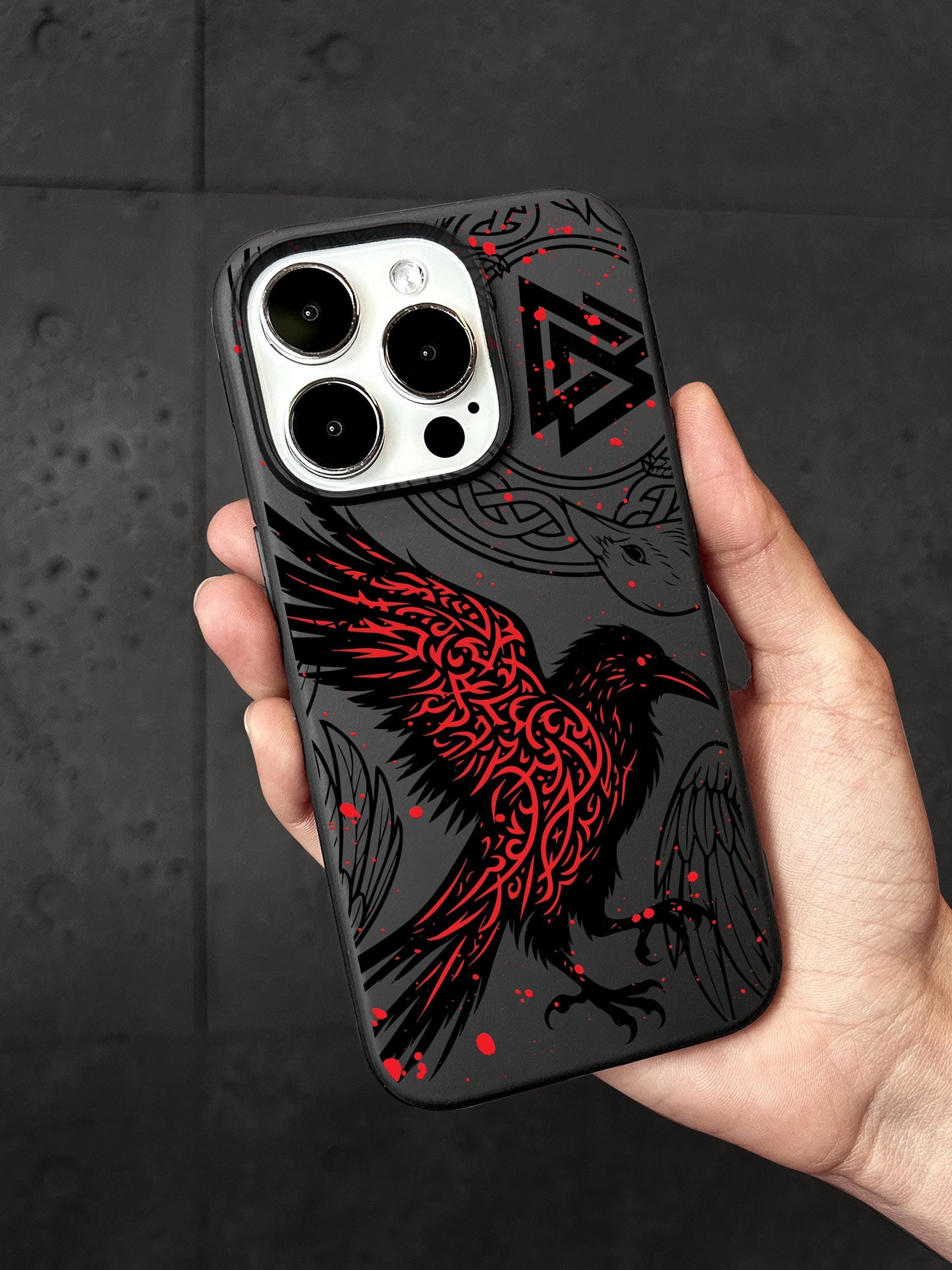 a person holding a phone case with a bird on it
