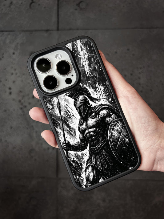 a hand holding a black and white iphone case