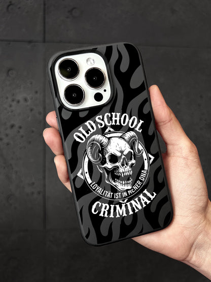 a person holding a black and white iphone case