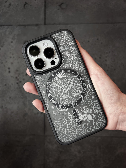 a person holding a black and white phone case
