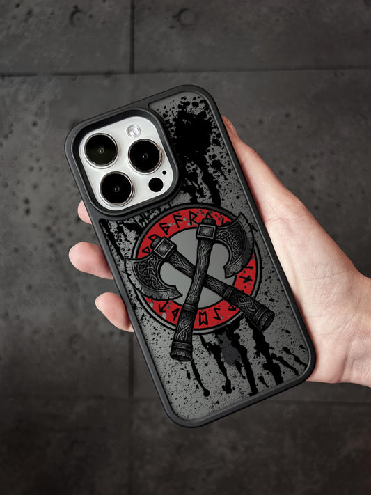 a person holding a phone case with a hammer and sick symbol on it