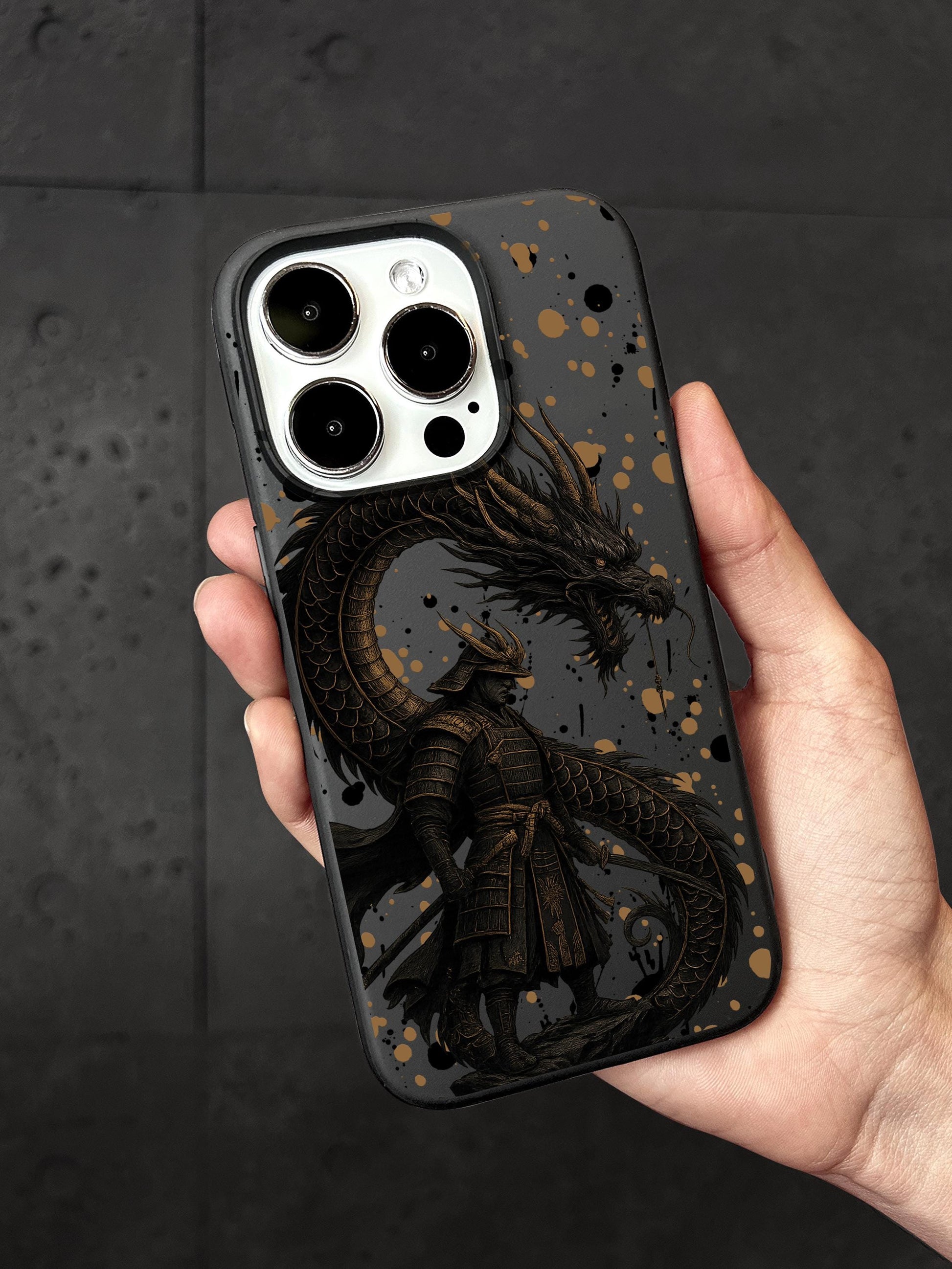 a person holding a phone case with a dragon on it